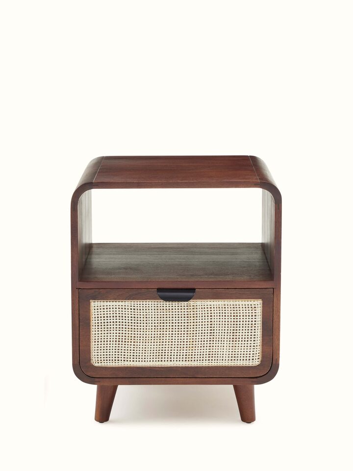 Front view of the mango wood and cane bedside table, highlighting its natural finish and intricate cane work.