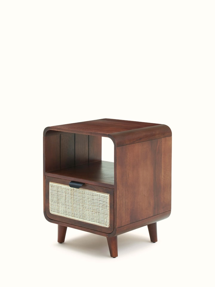 Close-up of the cane detailing on the mango wood bedside table, emphasizing the texture and pattern.