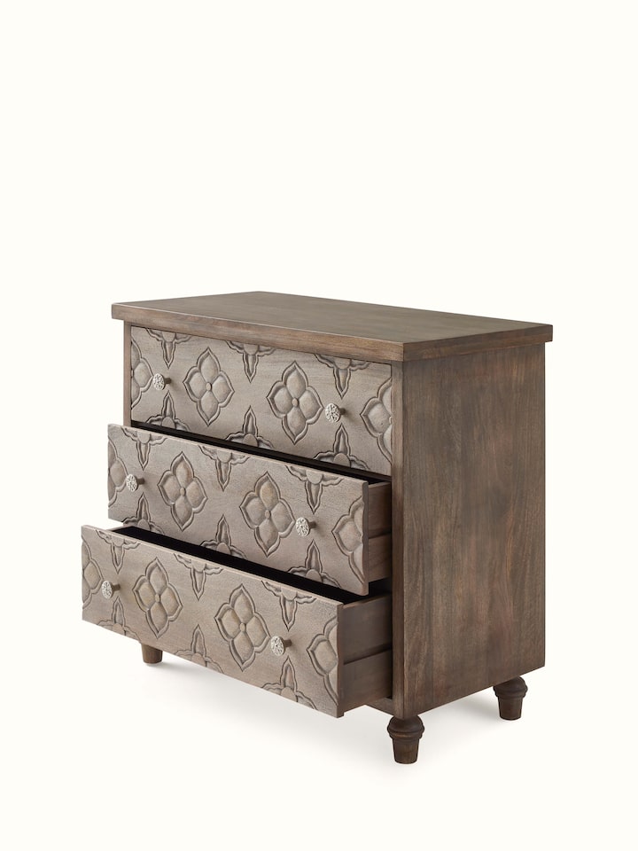 Full view of the mango wood chest of drawers in a room setting, showcasing its design and functionality