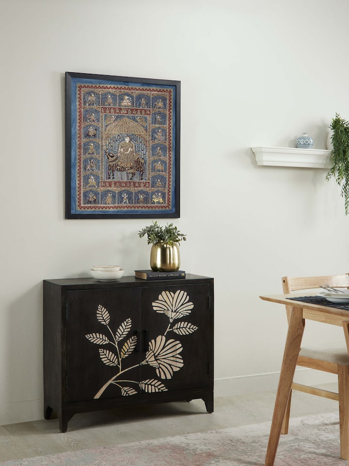 Side view of Sand etched mango wood sideboard highlighting the intricate sand etching and rich wood grain