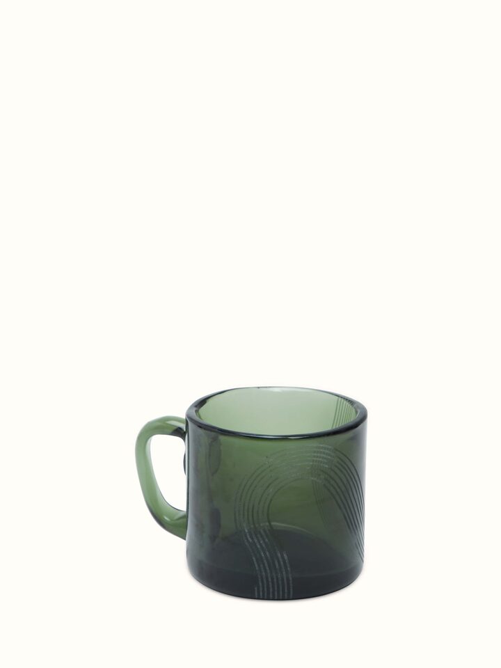 Firozabadi glass teacup with saucer in a close-up view, emphasizing the colorful and artistic design.