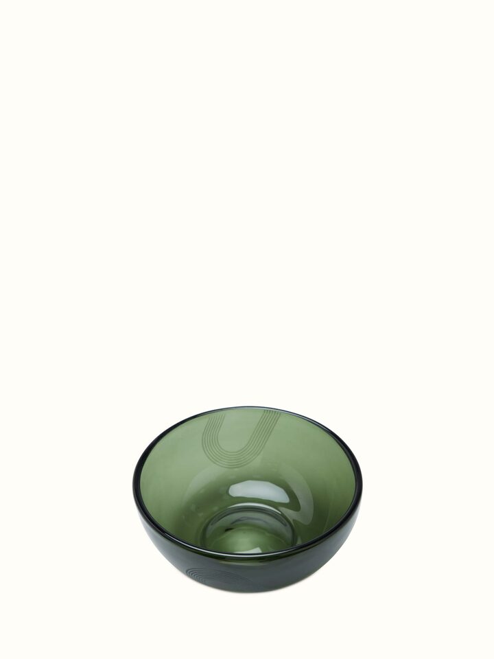 Angle view of large green Firozabadi glass serving bowl highlighting its sturdy build