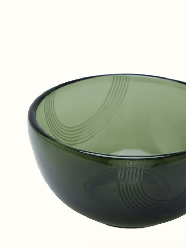 Close-up of Firozabadi glass serving bowl in green medium size focusing on the glass clarity and intricate design