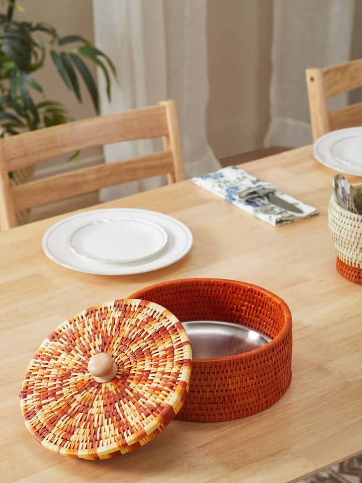 Side view of palm leaf woven roti box in brown, showcasing the sturdy construction and stylish design