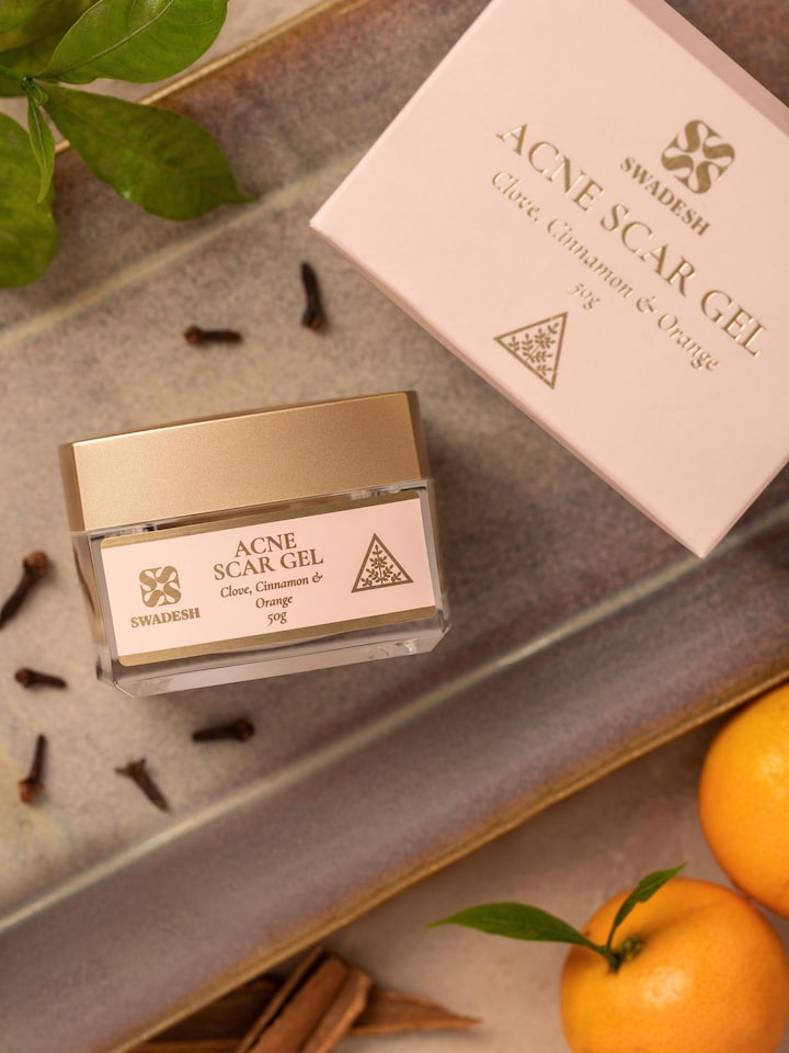 Styled detail view of Acne Scar Gel Clove, Cinnamon & Orange shown in an alternate styled setting