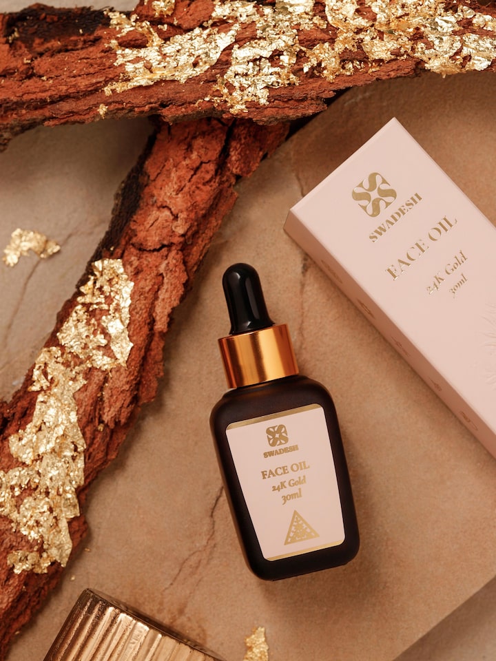 Side view of Face Oil 24K Gold highlighting the dropper design and elegant bottle shape