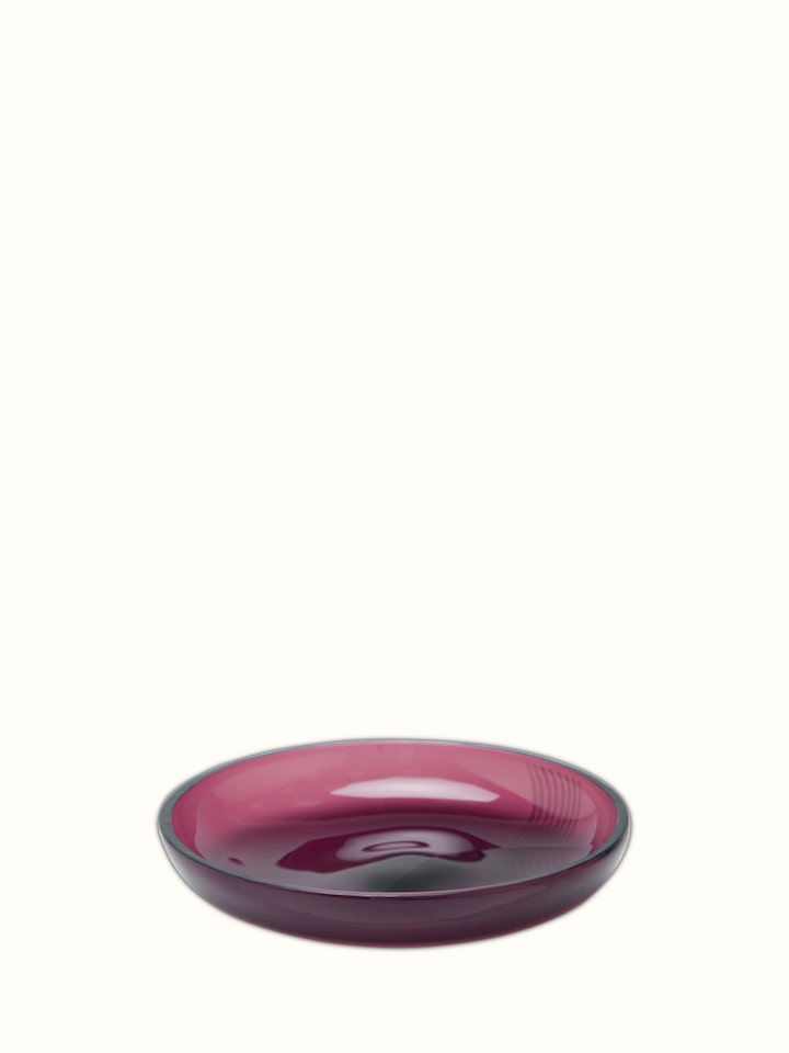 Close-up view of Firozabadi coloured glass teacup & saucer, focusing on the intricate details and finish.