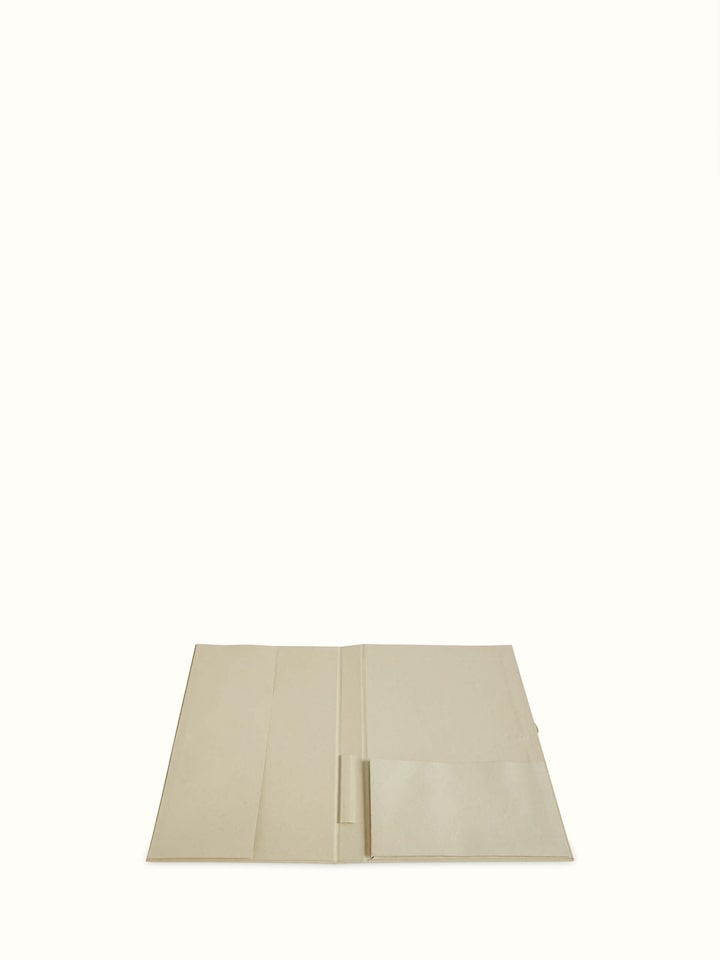 Side view of Warli painted paper file folder in brown, featuring vibrant Warli art and durable paper
