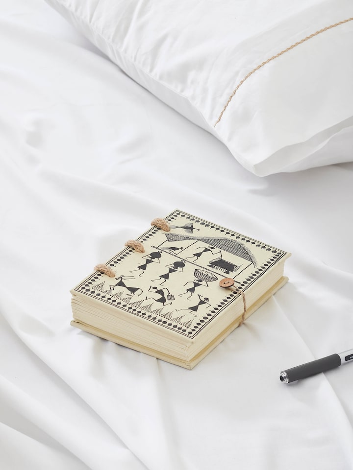 Side view of Warli painted paper planner brown highlighting its artistic design and craftsmanship