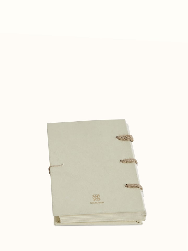 Angled view of Warli painted paper planner brown highlighting its elegant design and finish