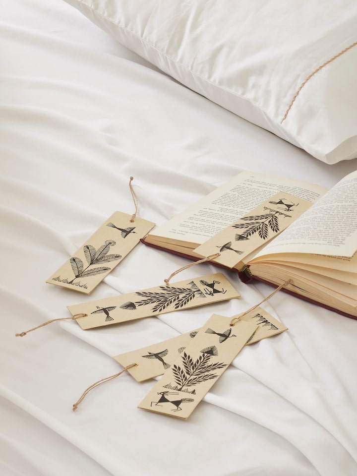 Side view of Warli painted paper bookmarks in brown (2 pcs) illustrating the thickness and craftsmanship.
