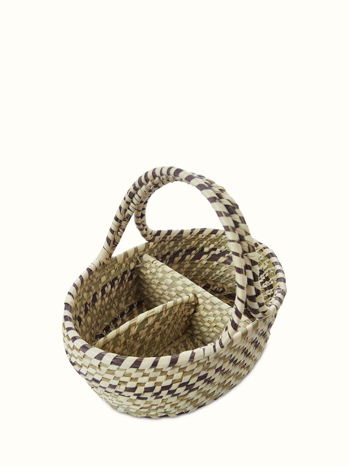 Angled view of Kanshi basketry natural fibre cutlery holder emphasizing the craftsmanship and functional design