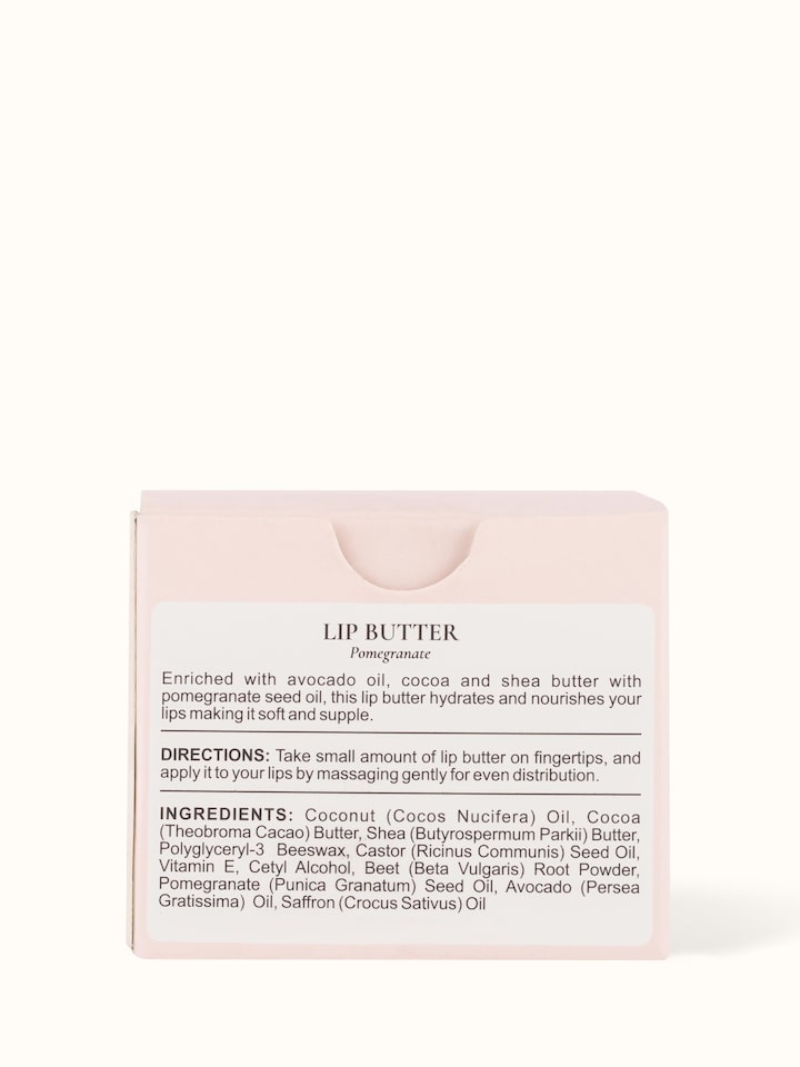 Back view of Lip Butter Pomegranate jar displaying the product’s ingredients and usage information on the label.
