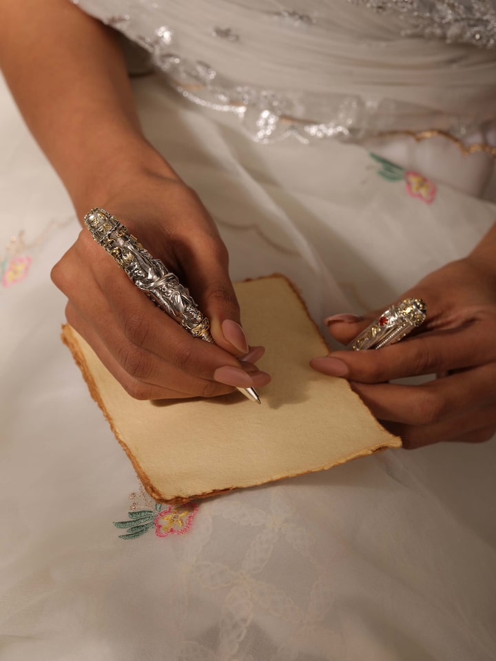 Close-up of Lord Sai Baba Silver Smithing Pen highlighting the detailed silverwork and craftsmanship.