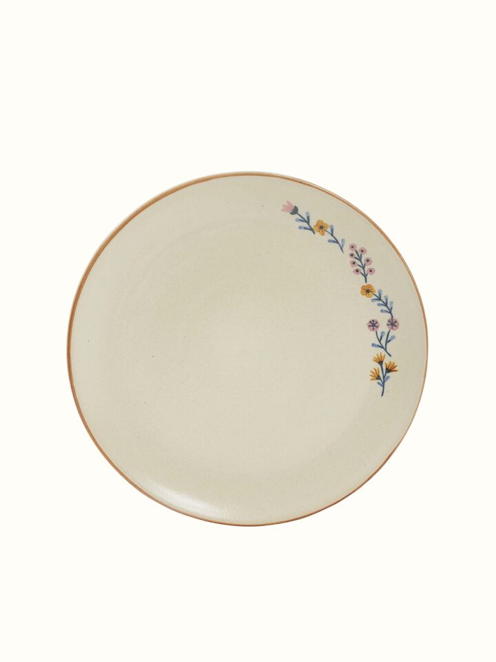 Angled view of beige studio pottery ceramic dinner plates set of 4, highlighting the elegant design details