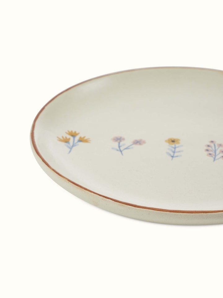 Angled view of Studio pottery ceramic side plates in beige (4 pcs) showcasing the finish