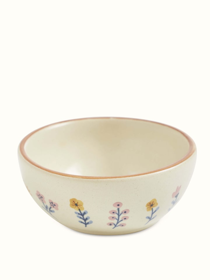 Angled view of Studio Pottery Ceramic Dinner Bowls in Beige, featuring the practical size and form