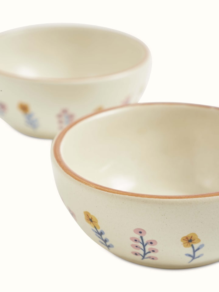 Overhead view of Studio Pottery Ceramic Dinner Bowls in Beige, showing the clean lines and uniform color