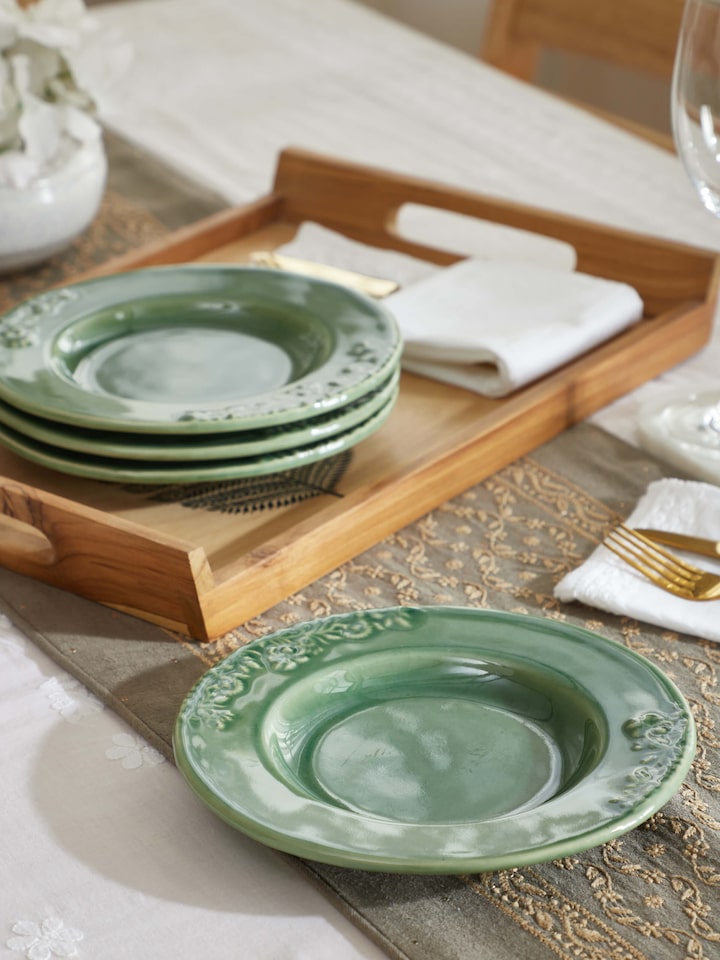 Side view of Studio Pottery Ceramic Dinner Plates in green, highlighting the smooth glaze and craftsmanship of the set