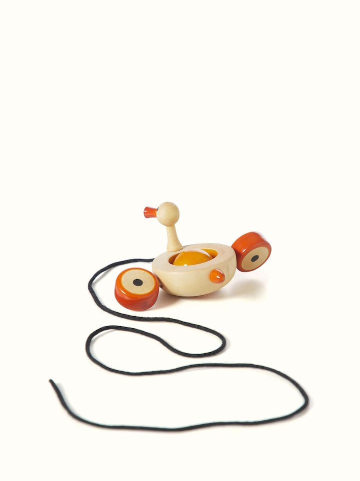Detailed close-up of Channapatna Ivory Wood Duby Duck Toy, focusing on the wood texture and hand-carved details