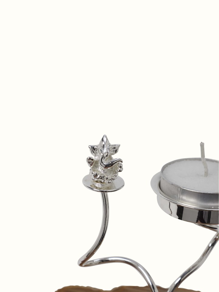 Close-up view of Silver-plated Ganesha tea light holder focusing on the ornate detailing and polished surface.