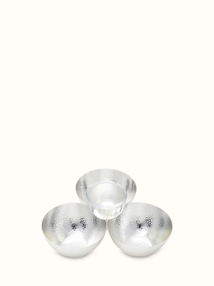 Side view of Silver-plated nut bowl focusing on sleek edges and reflective quality.