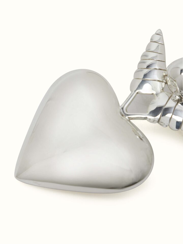Detail view of Silver Angel Rattle Toy focusing on its intricate design and silver detailing.
