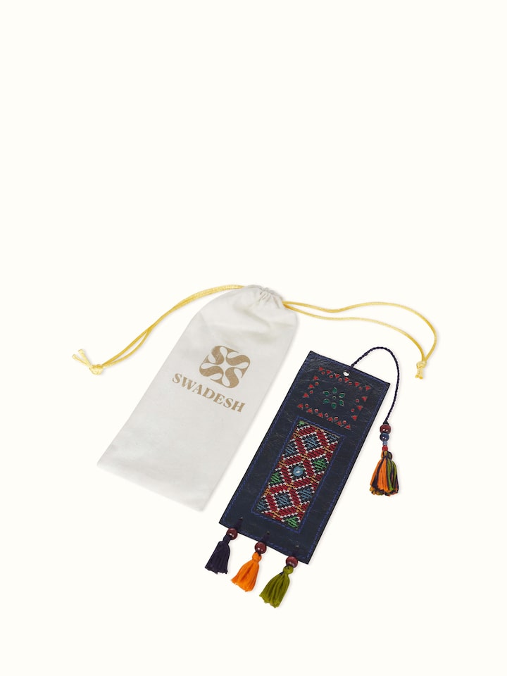 Side view of blue Kutch embroidery leather bookmark, showing the fine texture and craftsmanship.