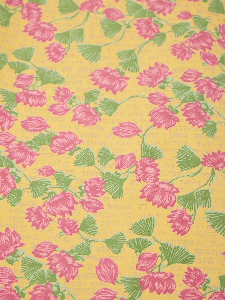 Top view of blue handmade paper wrapping sheets, highlighting their size and detailed design.