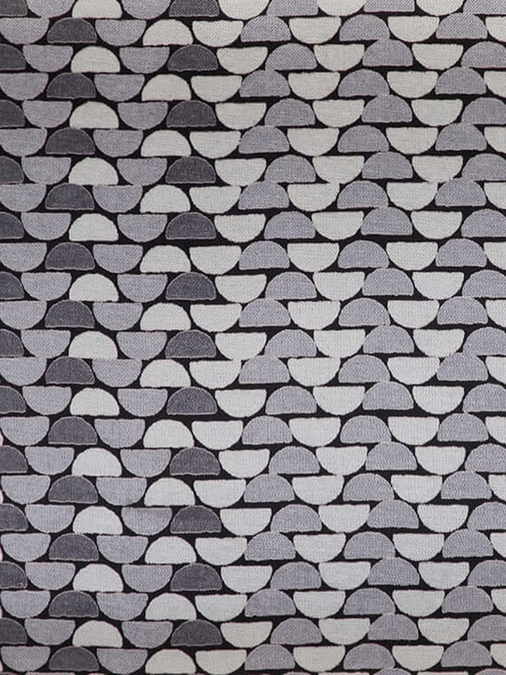 Detail shot of block print detailing with fine lines on soft cotton blend fabric.