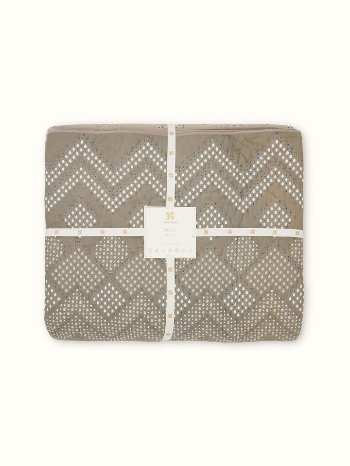 Full view of Rambagh green ombre geo cotton Sanganeri block printed double quilt showing its entire pattern and design.