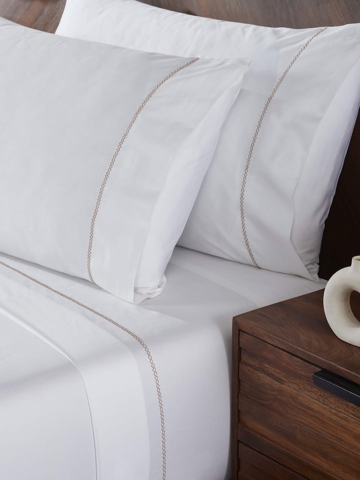 Detail view of Rambagh Green Stripe Cotton Hand Embroidery King-size Bedsheet Set highlighting the fabric texture and embroidery detail, from a dif...