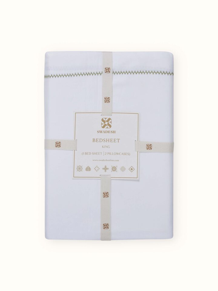 Detail view of Rambagh Green Stripe Cotton Hand Embroidery King-size Bedsheet Set highlighting the fabric texture and embroidery detail, with a sli...