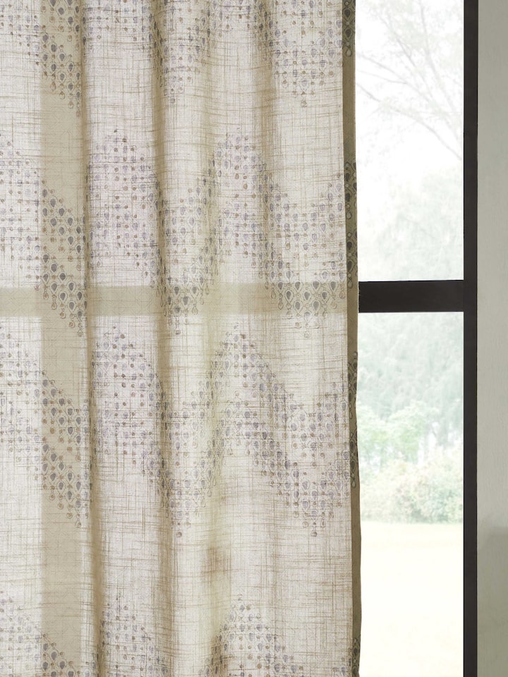 Angled view of Rambagh Light Green Modern Geo Chevron Cotton Sanganeri Block Printed Curtain (9 ft), displaying its design and drape.