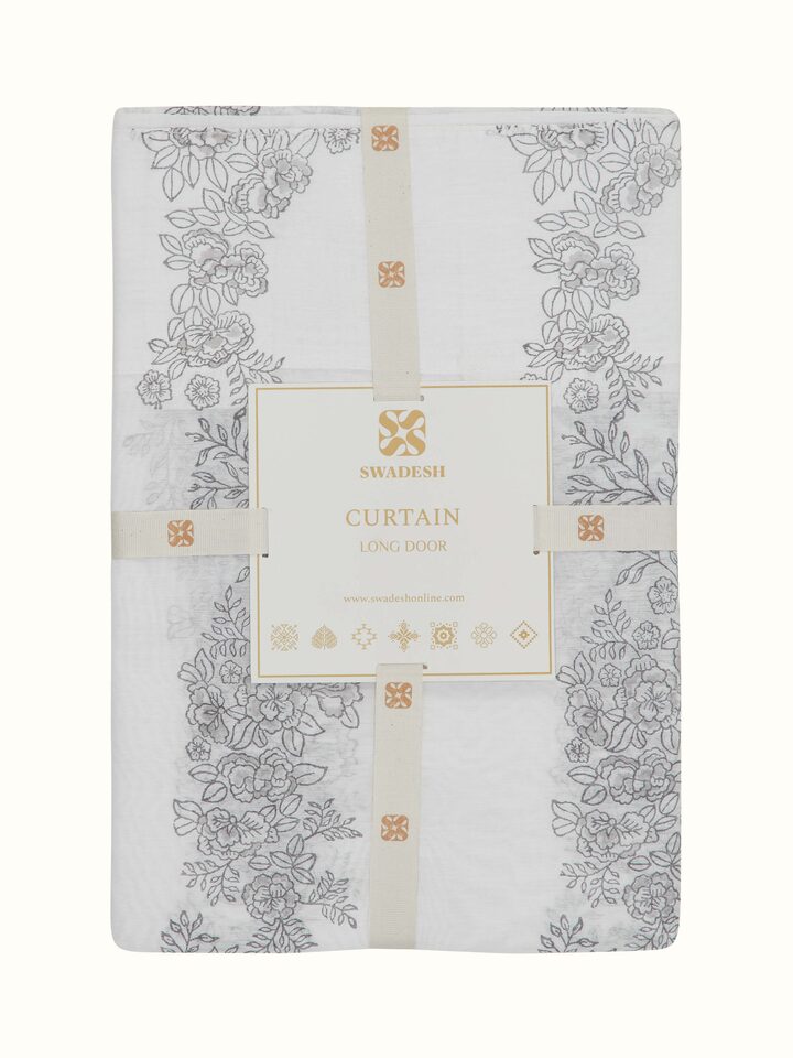 Folded view of Shivranjini white floral stripe cotton silk Sanganeri block printed curtain (9 ft) displaying its design and fabric texture.