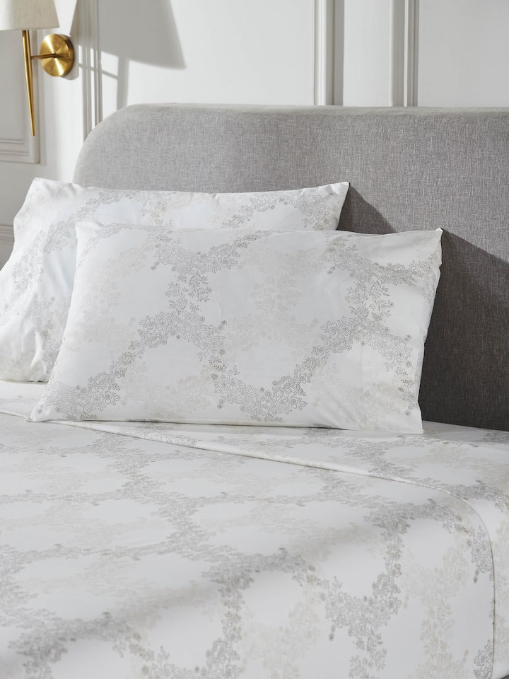 Detailed view of Shivranjini beige trellis cotton Sanganeri block printed king bedsheet set, including pillowcases
