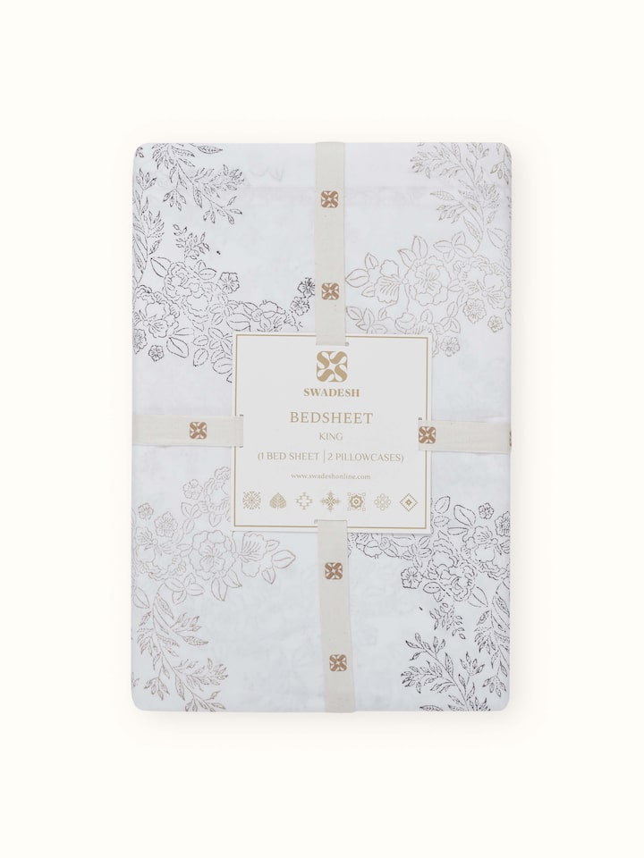 Artistic view of Shivranjini beige trellis cotton Sanganeri block printed king bedsheet set in a bedroom setting