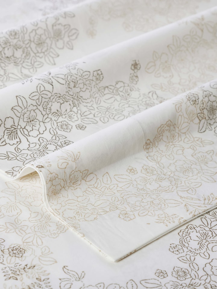 Close-up of Shivranjini beige trellis cotton Sanganeri block printed queen bedsheet set (3 pcs) focusing on the trellis pattern and block print details.