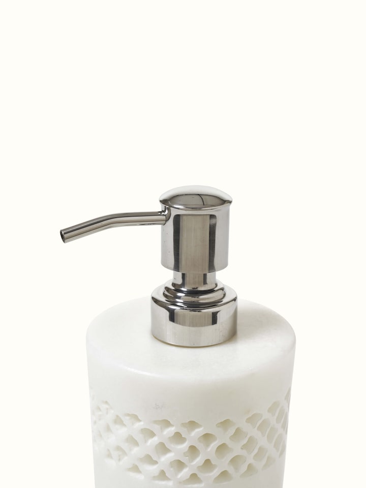 Bottom view of Carved Ambaji white marble soap dispenser with close-up of base details.