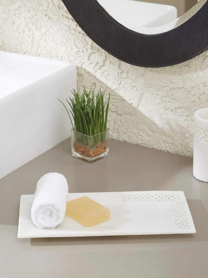 Side view of Carved Ambaji marble bath tray in white, showcasing its detailed carvings and smooth finish.