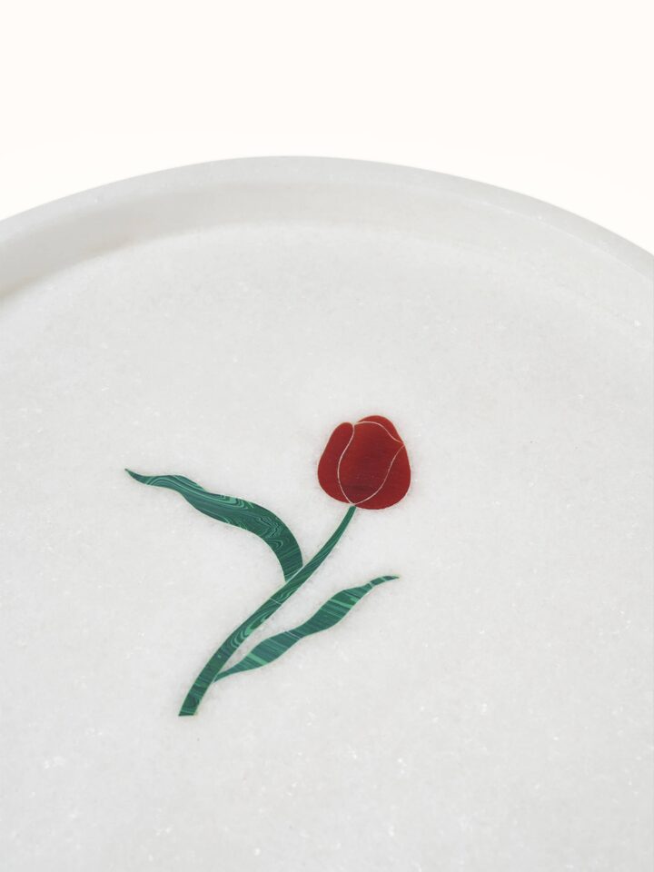 Detailed view of white carved Ambaji marble bath tray displaying sophisticated design