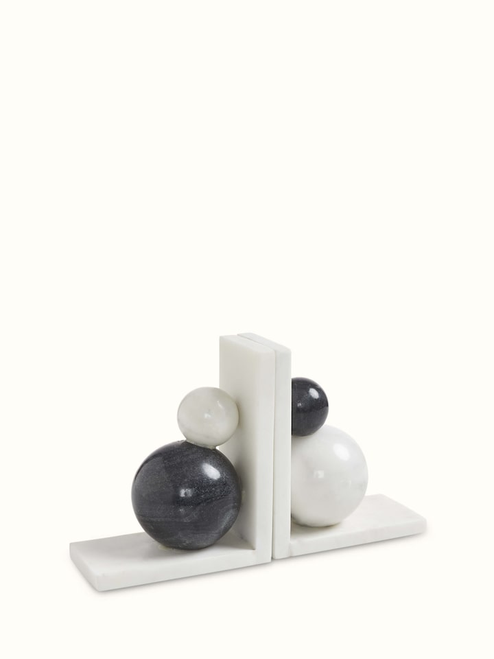 Detailed view of carved marble bookend in white color showcasing the elegant craftsmanship