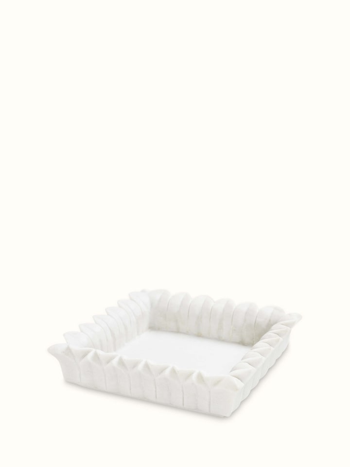 Top view of rectangular carved marble urli showing detailed craftsmanship