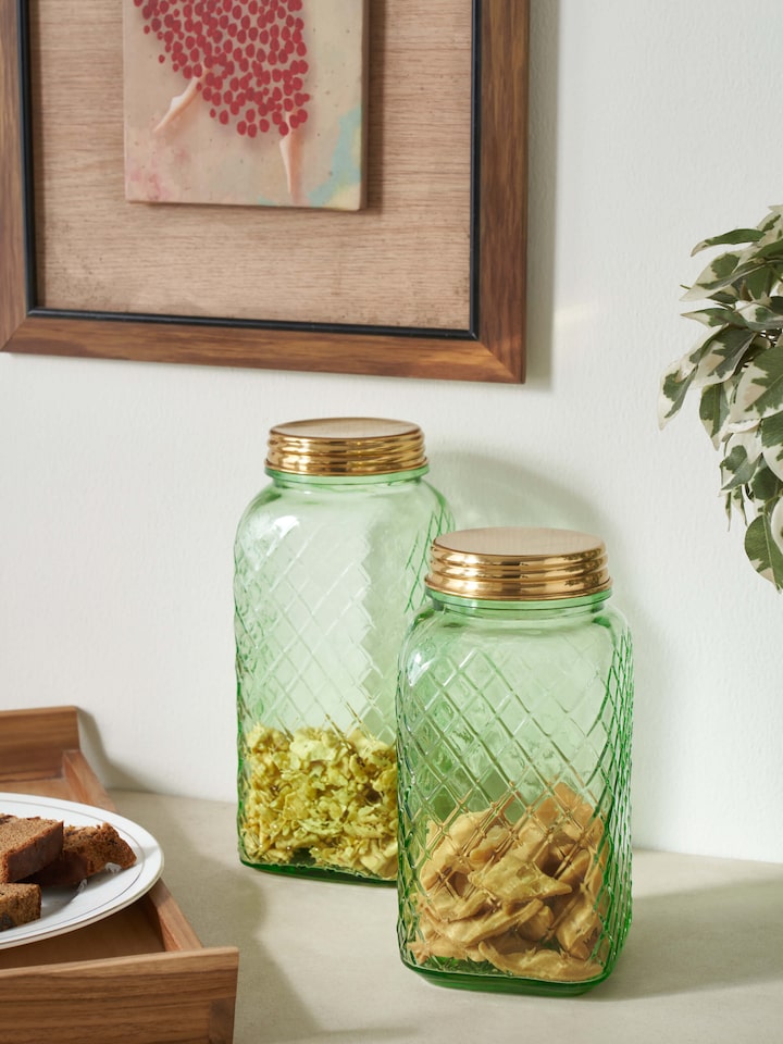 Side view of green glass-worked storage containers, set of 2, highlighting the glass texture and color.