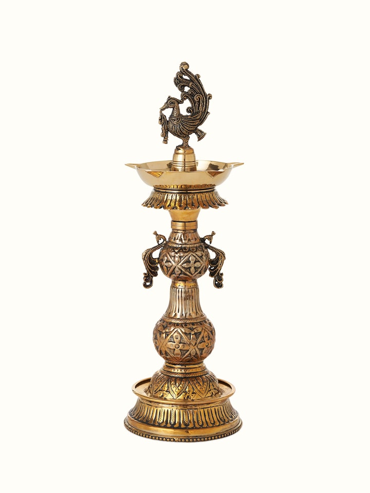 Front view of Polished Brass Mayur Vilakku showing the front design and form