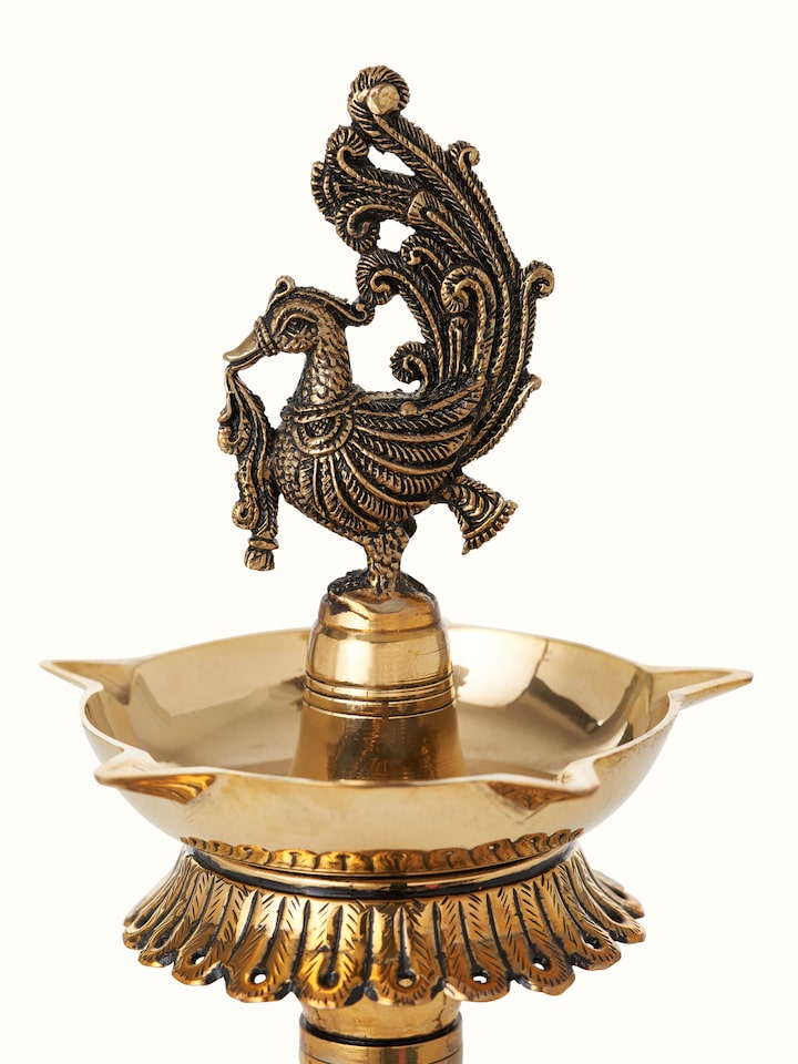 Detail view of Polished Brass Mayur Vilakku highlighting the handcrafted detailing and finish