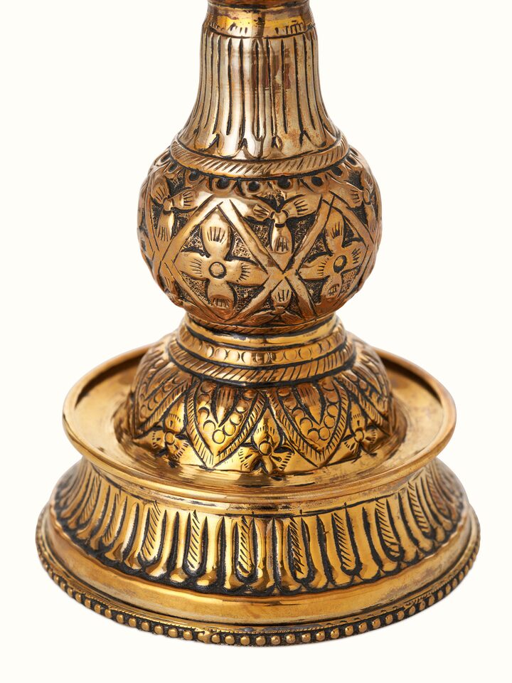 Detail view of Polished Brass Mayur Vilakku highlighting the handcrafted detailing and finish, from a different angle