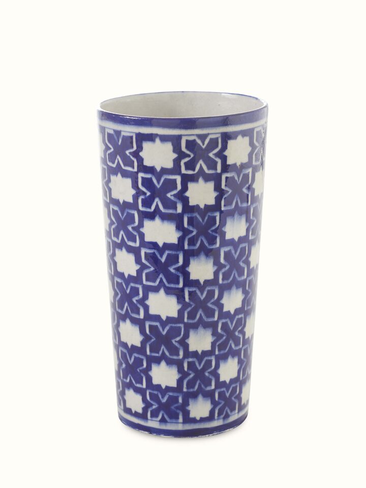 Detailed view of a blue pottery ceramic table vase, showcasing its elegant blue patterns and craftsmanship.