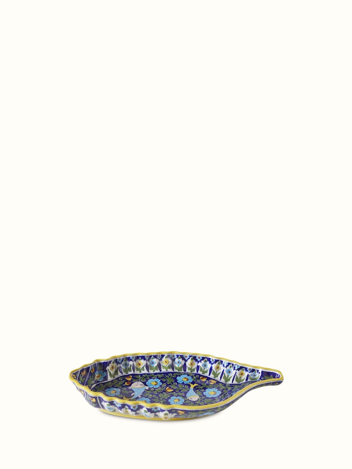Side view emphasizing the intricate shell art design