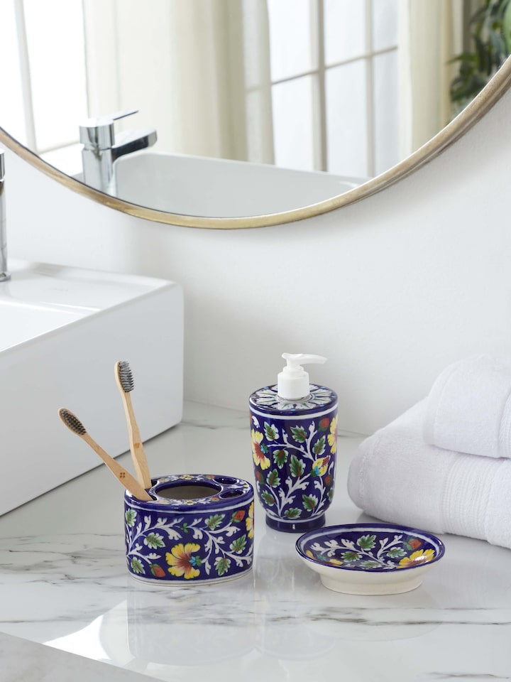 Side view of blue pottery ceramic soap dish displaying its elegant curve and decorative patterns